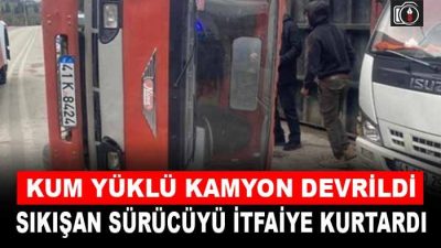 Karamürsel’de kum yüklü kamyon devrildi. Devrilen TIR’da sıkışan sürücü itfaiye