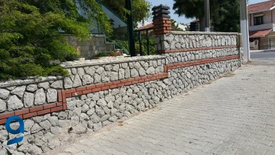 Körfez Belediyesi, ilçede 1700 metreküp taş duvar yapımını kapsayan yapım